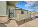 Welcoming front entrance with beautiful door design and manicured landscaping at 9183 W Cedar Dr # 2, Lakewood, CO 80226