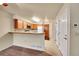 Kitchen and eating area features tile counters, wood cabinets, and tile flooring at 9183 W Cedar Dr # 2, Lakewood, CO 80226