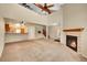 Spacious living room features a fireplace and staircase at 9183 W Cedar Dr # 2, Lakewood, CO 80226