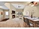 Bright living room featuring fireplace, ceiling fan and neutral decor at 9183 W Cedar Dr # 2, Lakewood, CO 80226