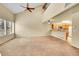 Bright living room featuring vaulted ceilings, large windows, and an open layout to the kitchen at 9183 W Cedar Dr # 2, Lakewood, CO 80226