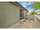 Townhome side entrance with a security gate and small patio area at 9183 W Cedar Dr # 2, Lakewood, CO 80226