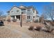 Attractive townhome with gray siding, stone accents, and manicured landscaping at 14300 Waterside Ln # S2, Broomfield, CO 80023