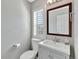 Bathroom with a modern sink and vanity, and a large window with shutter style blinds at 1465 Red Cliff Way, Castle Rock, CO 80109