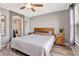 Relaxing bedroom with a comfortable bed, ensuite bathroom, and natural light at 1465 Red Cliff Way, Castle Rock, CO 80109