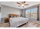 Cozy bedroom featuring a ceiling fan, natural light, and warm-toned wood accents at 1465 Red Cliff Way, Castle Rock, CO 80109