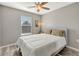 Bright bedroom featuring natural light, ceiling fan and neutral decor at 1465 Red Cliff Way, Castle Rock, CO 80109