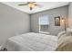 Bright bedroom featuring natural light, ceiling fan and neutral decor at 1465 Red Cliff Way, Castle Rock, CO 80109