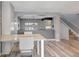 Open-concept dining area with stylish table and seating, next to the living area at 1465 Red Cliff Way, Castle Rock, CO 80109