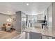 Bright kitchen features stainless steel appliances, modern white cabinets, and a stylish table with seating at 1465 Red Cliff Way, Castle Rock, CO 80109