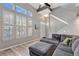 Bright living room with vaulted ceiling, large windows, modern shutters, and a comfortable gray sectional sofa at 1465 Red Cliff Way, Castle Rock, CO 80109
