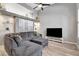 Spacious living room featuring a comfortable gray sofa, modern decor, and hardwood floors at 1465 Red Cliff Way, Castle Rock, CO 80109