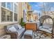 Outdoor patio with comfortable seating arrangement and stone flooring, perfect for relaxation and entertainment at 1465 Red Cliff Way, Castle Rock, CO 80109