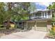 Lovely exterior displaying a two-car garage, and a spacious front yard at 7150 S Curtice St, Littleton, CO 80120