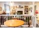 Cozy living room featuring a fireplace, built-in shelving, and comfortable seating visible from dining area at 7150 S Curtice St, Littleton, CO 80120
