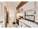 Well-lit kitchen with wood beam and modern appliances for cooking at 4162 S Richfield S Way, Aurora, CO 80013