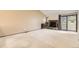 Spacious living room with a stone fireplace and sliding glass doors at 4162 S Richfield S Way, Aurora, CO 80013