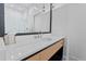 Modern bathroom with a sleek vanity, stylish mirror, and contemporary fixtures at 1265 S Gaylord St, Denver, CO 80210