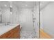 Modern bathroom with sleek shower, vanity, and white subway tile at 1265 S Gaylord St, Denver, CO 80210