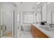 Elegant bathroom boasting double sinks, marble floors, and a luxurious soaking tub at 1265 S Gaylord St, Denver, CO 80210