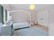 Playful bedroom with a canopy bed, pink wallpaper, and charming decor at 1265 S Gaylord St, Denver, CO 80210