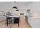 Open kitchen with an island, stainless steel appliances, and seamless flow to the living areas at 1265 S Gaylord St, Denver, CO 80210