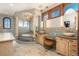 Elegant bathroom features tile work, dual sinks, vanity, and a large shower at 8871 Aspen Leaf Ct, Littleton, CO 80125
