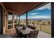 Back deck is set up for outdoor dining and offers scenic views at 8871 Aspen Leaf Ct, Littleton, CO 80125