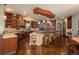 Spacious kitchen features stone accents, breakfast bar, and modern appliances at 8871 Aspen Leaf Ct, Littleton, CO 80125