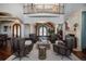 Living room featuring a fireplace and second-story balcony at 8871 Aspen Leaf Ct, Littleton, CO 80125
