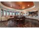 Expansive living room with a wet bar, recessed lighting, and panoramic views from large windows at 8871 Aspen Leaf Ct, Littleton, CO 80125