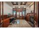 Bright office with wood trim, fireplace, and mountain views at 8871 Aspen Leaf Ct, Littleton, CO 80125