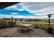 Outdoor patio with dining set and heaters offers views of the surrounding landscape at 8871 Aspen Leaf Ct, Littleton, CO 80125
