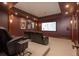 Home theater room with plush seating, a large screen, and ambient lighting for an immersive experience at 8871 Aspen Leaf Ct, Littleton, CO 80125