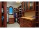 Large walk-in closet with custom shelving, drawers, and a center island at 8871 Aspen Leaf Ct, Littleton, CO 80125