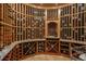 Custom wine cellar featuring extensive shelving, temperature control, and dedicated display areas at 8871 Aspen Leaf Ct, Littleton, CO 80125