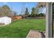 Spacious backyard with lush green grass, perfect for outdoor activities and relaxation at 11600 W 31St Pl, Lakewood, CO 80215