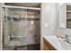 Bathroom with a glass enclosed shower with stone tile at 11600 W 31St Pl, Lakewood, CO 80215