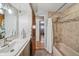 Well-lit bathroom showcasing a neutral-toned bathtub, updated vanity, and modern fixtures at 11600 W 31St Pl, Lakewood, CO 80215