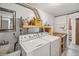 Functional laundry room with washer, dryer, utility sink and counter space at 11600 W 31St Pl, Lakewood, CO 80215