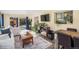 Spacious open-concept living area with stylish furnishings, natural light, and views of the backyard at 11600 W 31St Pl, Lakewood, CO 80215