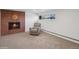 Spacious living room with a fireplace and a comfortable armchair at 11600 W 31St Pl, Lakewood, CO 80215
