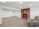 Spacious living room with a brick fireplace and carpeted flooring at 11600 W 31St Pl, Lakewood, CO 80215