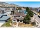Stunning aerial view of a well-maintained home with mature trees in a peaceful neighborhood with mountain views at 789 Zamia Ave, Boulder, CO 80304