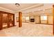 Spacious carpeted basement with fireplace, natural light, and wood accents at 789 Zamia Ave, Boulder, CO 80304