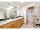 Bathroom with double sinks, tile counters and a tub shower at 789 Zamia Ave, Boulder, CO 80304