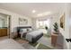 This staged bedroom boasts neutral paint, ample light, and a modern style at 789 Zamia Ave, Boulder, CO 80304