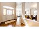 Elegant foyer showcasing hardwood floors, a white front door, and seamless transition to the living and dining areas at 789 Zamia Ave, Boulder, CO 80304