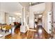 Bright open foyer with hardwood floors, elegant columns, and views of the dining and living areas, inviting flow at 789 Zamia Ave, Boulder, CO 80304