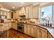 Gourmet kitchen with custom cabinetry, stone countertops, stainless steel appliances, and hardwood floors at 789 Zamia Ave, Boulder, CO 80304